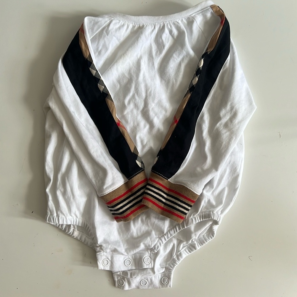Burberry onesie, long sleeve.  I’m perfect condition